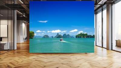 Boat in the ocean with islands Wall mural