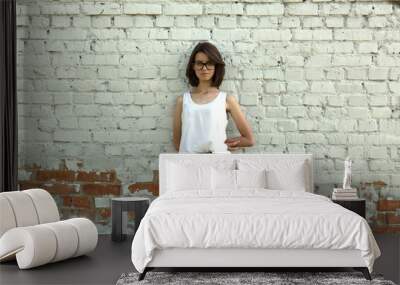 Portrait of a young student with glasses. Wall mural