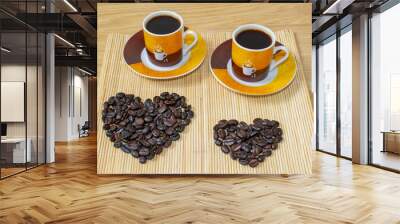 Two cups of coffee and a heart made of coffee beans. Wall mural