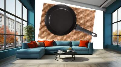 Top view of an empty new frying pan located on a wooden patterned bamboo mat Wall mural