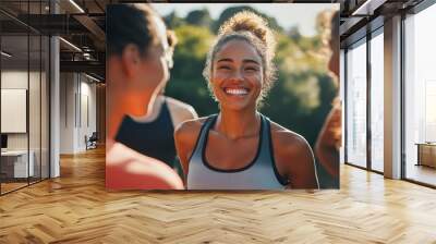  a group of people outside enjoying life, smiling, and wearing athletic clothes  Wall mural