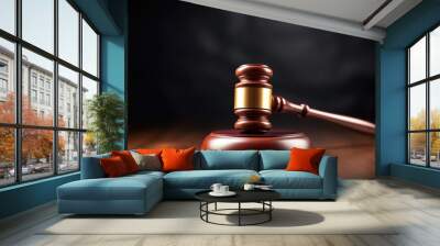 Close-up of a wooden judge's gavel on a dark wooden surface, symbolizing law and justice. Wooden Gavel on Dark Background Wall mural