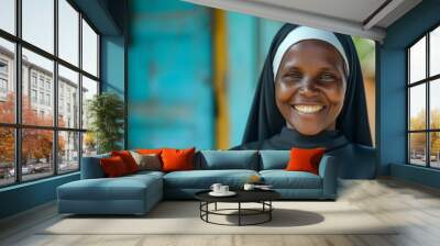 Portrait of a joyful african nun smiling outdoors. Radiating happiness and faith in her traditional habit Wall mural