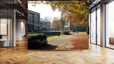 Serene autumn morning light on a college campus with tranquil and peaceful scenery, showcasing the beautiful foliage and golden hour sunlight Wall mural