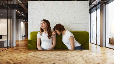 Friend problems concept. Upset girl crying in shoulder girls. Female talk about quarrel with boyfriend. Time to change job after psychological burnout. Wall mural