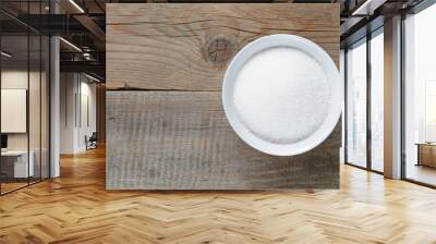 White sugar on wooden table Wall mural