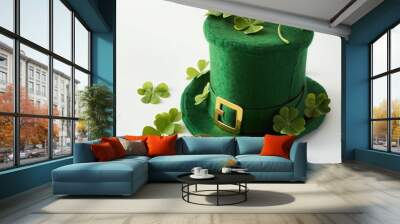 St. Patrick's day celebration: green leprechaun hat with shamrock decorations and gold bitcoins Wall mural