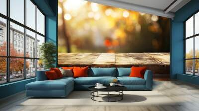 Wooden table with autumn background. Bokeh. place for text.  Wall mural