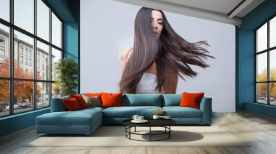 Beautiful Brunette Girl with Healthy Long Hair Wall mural