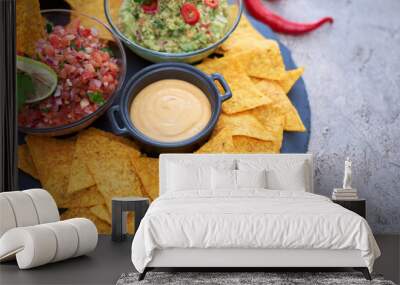 freshly made salsa and guacamole dip sauce with nacho chips on stone serving board Wall mural