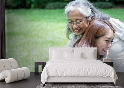 Portrait images of Asian elderly mother is embraced the daughter, are smile with happiness, to relationship in family and health care concept. Wall mural