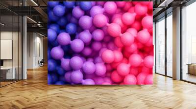 Colorful abstract background featuring spheres in shades of pink and purple, creating a vibrant and playful visual texture. Wall mural