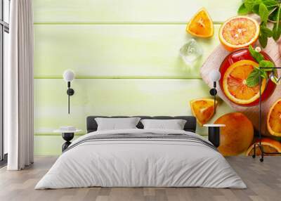 Bloody orange drink and ingredients, copy space Wall mural