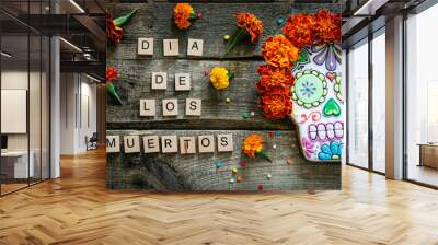 Day of the dead concept dia de los muertos - skull shapes cookie with marigold flowers, top view Wall mural