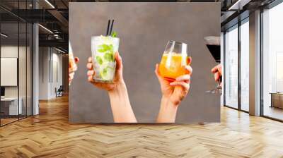 Hands holding classic cocktails on rustic background Wall mural