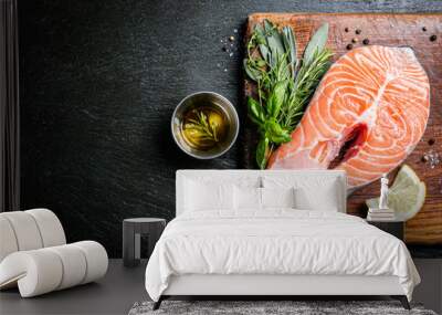 Raw salmon with herbs and spices, rustic background, copy space Wall mural