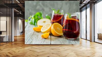 Sangria and ingredients in glasses Wall mural