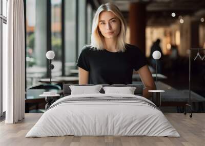 Young blonde woman wearing bella canvas black t shirt and jeans, at a cozy restaurant on summers day. Design tshirt template, print presentation mockup. Ai generated. Wall mural