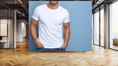 Young man wearing bella canvas white shirt mockup, at blue background. Design tshirt template, print presentation mock-up. AI generated. Wall mural