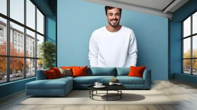 Young man wearing white sweatshirt mockup, at blue background. Design pullover template, print presentation mock-up. AI generated. Wall mural