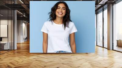 Young woman wearing bella canvas white shirt mockup, at blue background. Design tshirt template, print presentation mock-up. AI generated. Wall mural