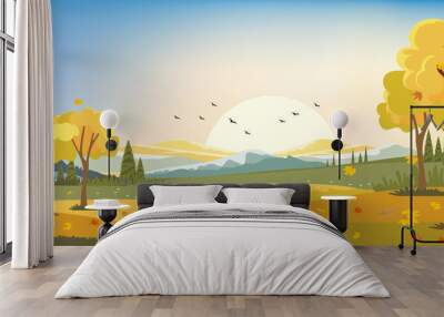 Autumn landscape, farm field with maple leaves falling from trees, Fall season with sunset in evening. Wall mural