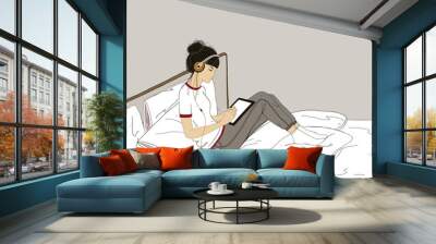 Illustration young girl sitting in bed with cat, Digital paint Hipster style girl character with long hair wearing pajama, drawing on tablet and listening to music. Wall mural