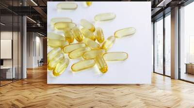 Selective focus of Fish oil capsules isolated on white background Wall mural