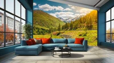 Colorful Alpine scenery with sun setting down Wall mural