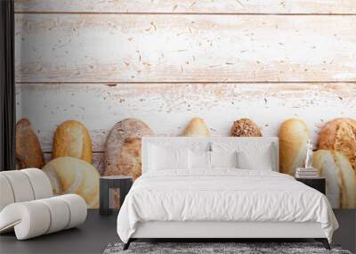 Delicious fresh bread on wooden background Wall mural