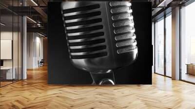 Vintage microphone on black background Wall mural