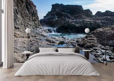 Reflections in volcanic igneous rock pool in La Palma, Canary Island, Spain Wall mural