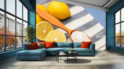 Lemons and citric acid in a wooden spoon Wall mural