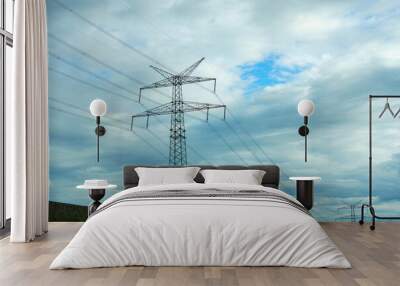 High-voltage pole against the background of the evening cloudy sky. Wall mural