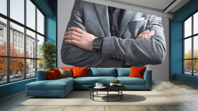 Caucasian businessman standing with crossed arms. Wall mural