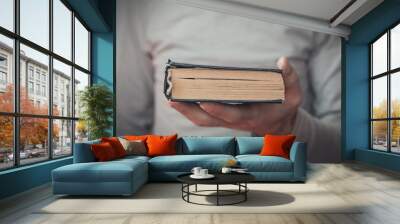 Caucasian man holding bible. Religion Wall mural