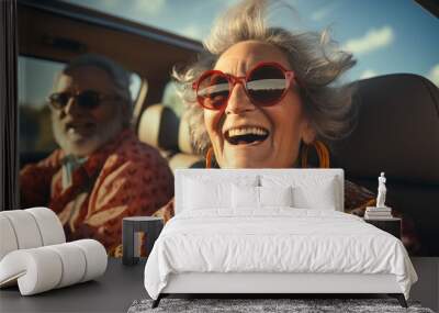 Elderly happy couple driving a car. Wall mural