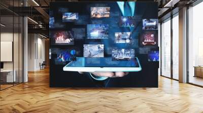 Man holding a digital pictures of business graphs. Business. Technology Wall mural