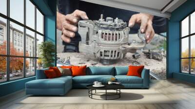 Man repairs car alternator. Technology. Industry Wall mural