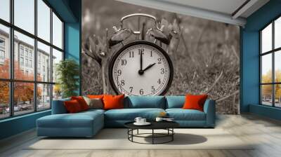 Daylight saving time. Alarm clock switched to summer time. Changing clock from wintertime to summertime. At 2 o'clock at night time is presented for one hour. Concept: energy saving Wall mural