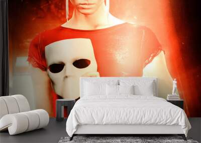 Young woman holding mask. Wall mural