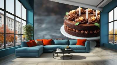 Chocolate cake with candles. Great for birthday, anniversary, and other celebration occasions. Food background for product mockup and text. Extra space for copy. Wall mural