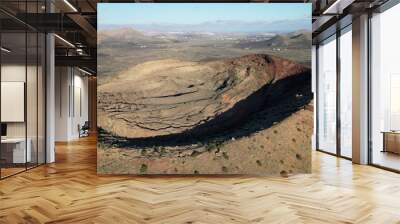 Drone aerial view of Volcán de La Corona is a 609 meters high extinct volcano on the Canary Island of Lanzarote, close to  Yé and  Haría in Canaries island , Spain - crater volcano view  Wall mural