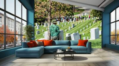 WASHINGTON D.C., USA - MAY, 2 2014 - worker is cleaning tombstones at Arlington cemetery Wall mural