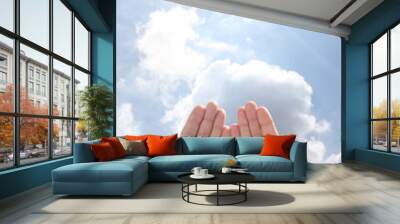 open man's hands rising to the sky in a pray gesture with copy space for your text Wall mural