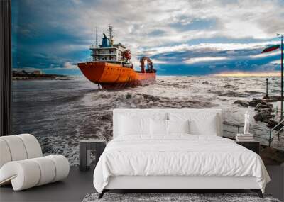 Cargo ship stranded in the waves Wall mural