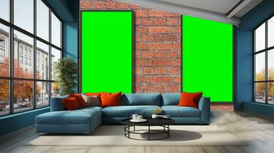 Two picture frame on a green screen placed on a red brick wall Wall mural