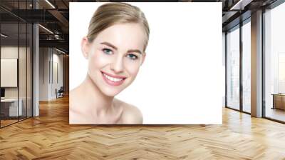 Beautiful young blond smiling woman with clean skin, natural make-up and perfect white teeth white background Wall mural