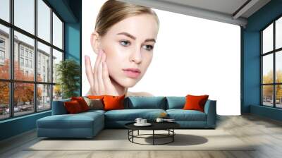 Beautiful Young Blond Woman with Perfect Skin touching her face. Facial treatment. Cosmetology, beauty and spa concept. Isolated on white background Wall mural