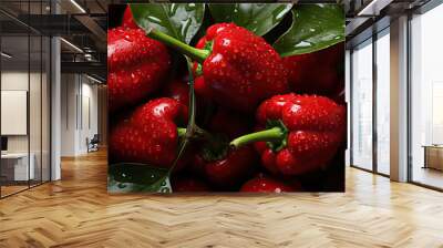 Background of red sweet peppers with green leaves. Wall mural